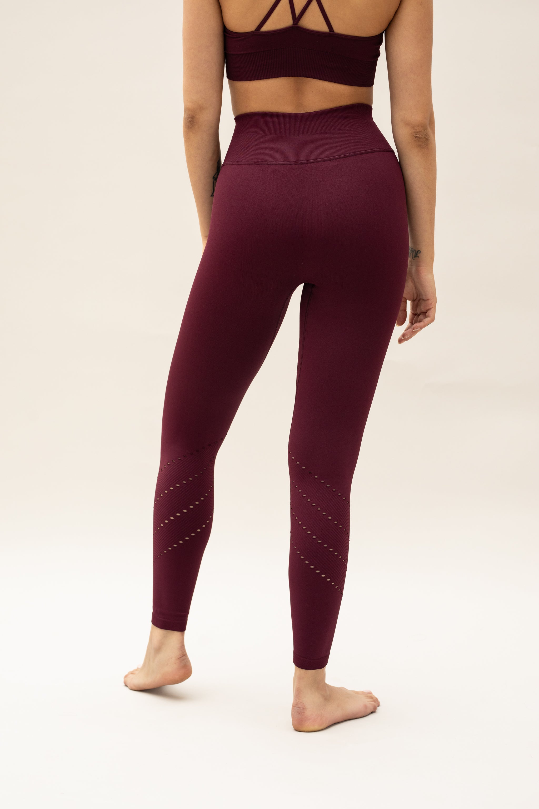 Purple red leggings and purple red bra for women by sustainable activewear brand Jilla. 
