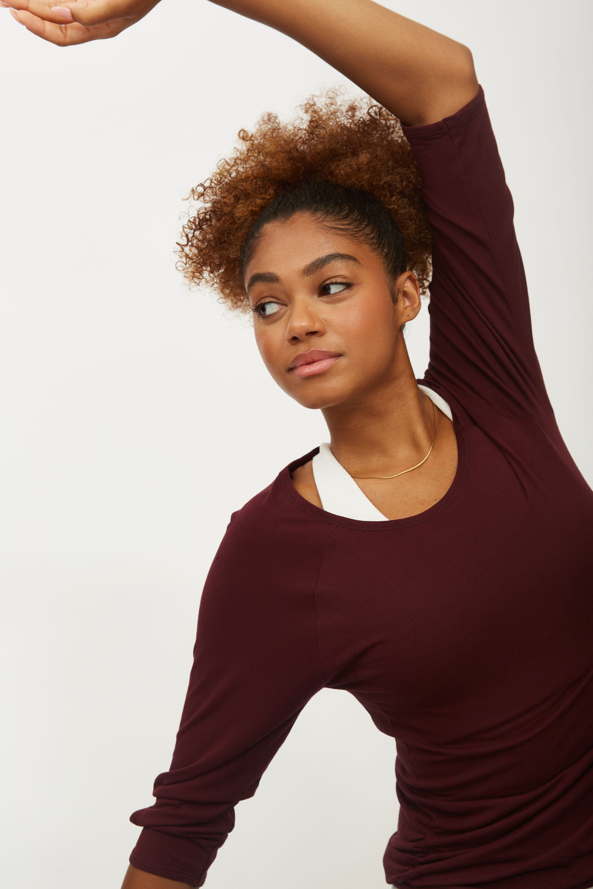 Dark cherry red soft bamboo 3/4 sleeve performance round neck top with side ruching for yoga, pilates, running and exercise by sustainable activewear brand Jilla Active.  Edit alt text