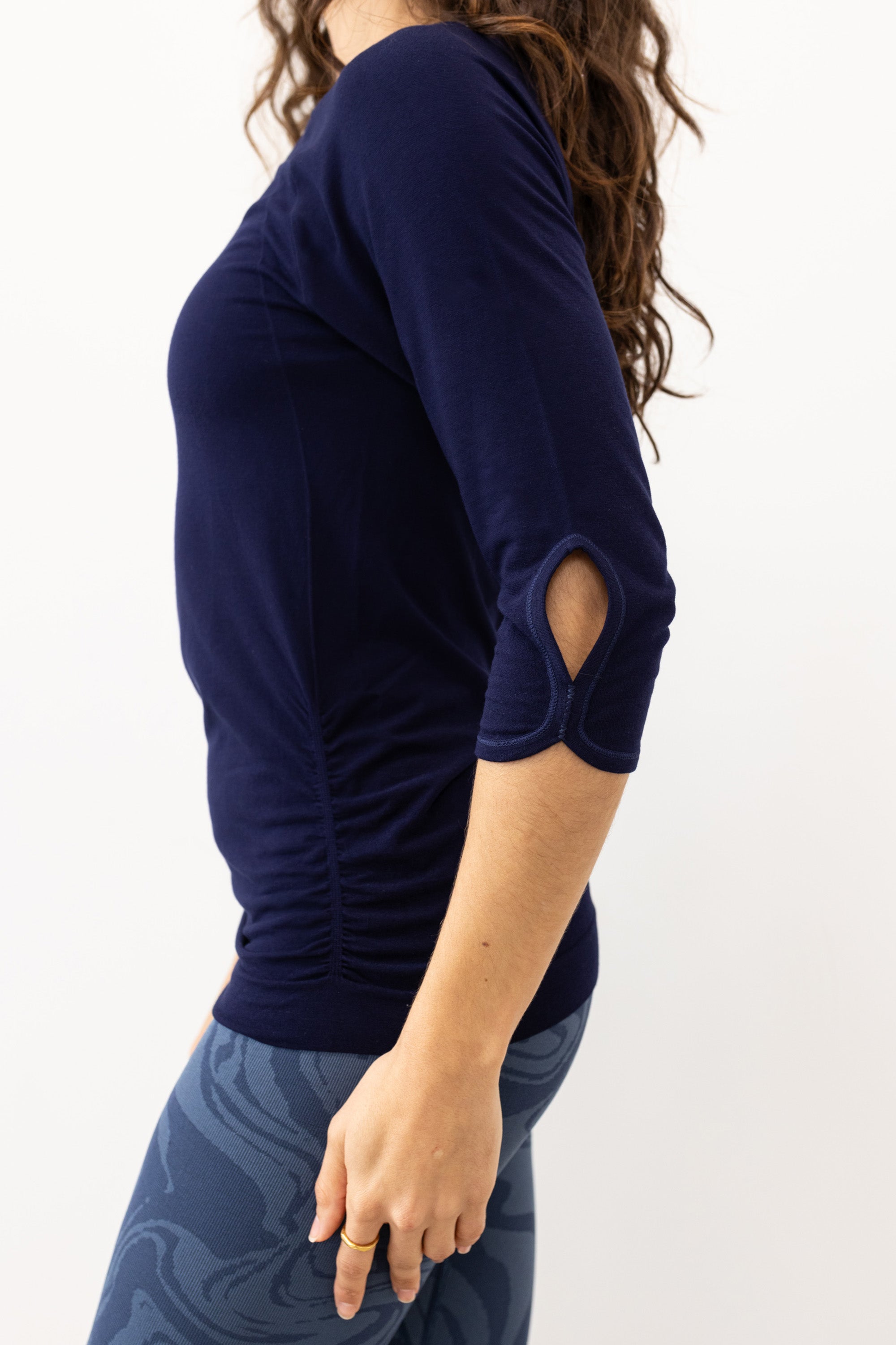 Navy blue soft bamboo 3/4 sleeve performance round neck top with side ruching for yoga, pilates, running and exercise by sustainable activewear brand Jilla Active. 