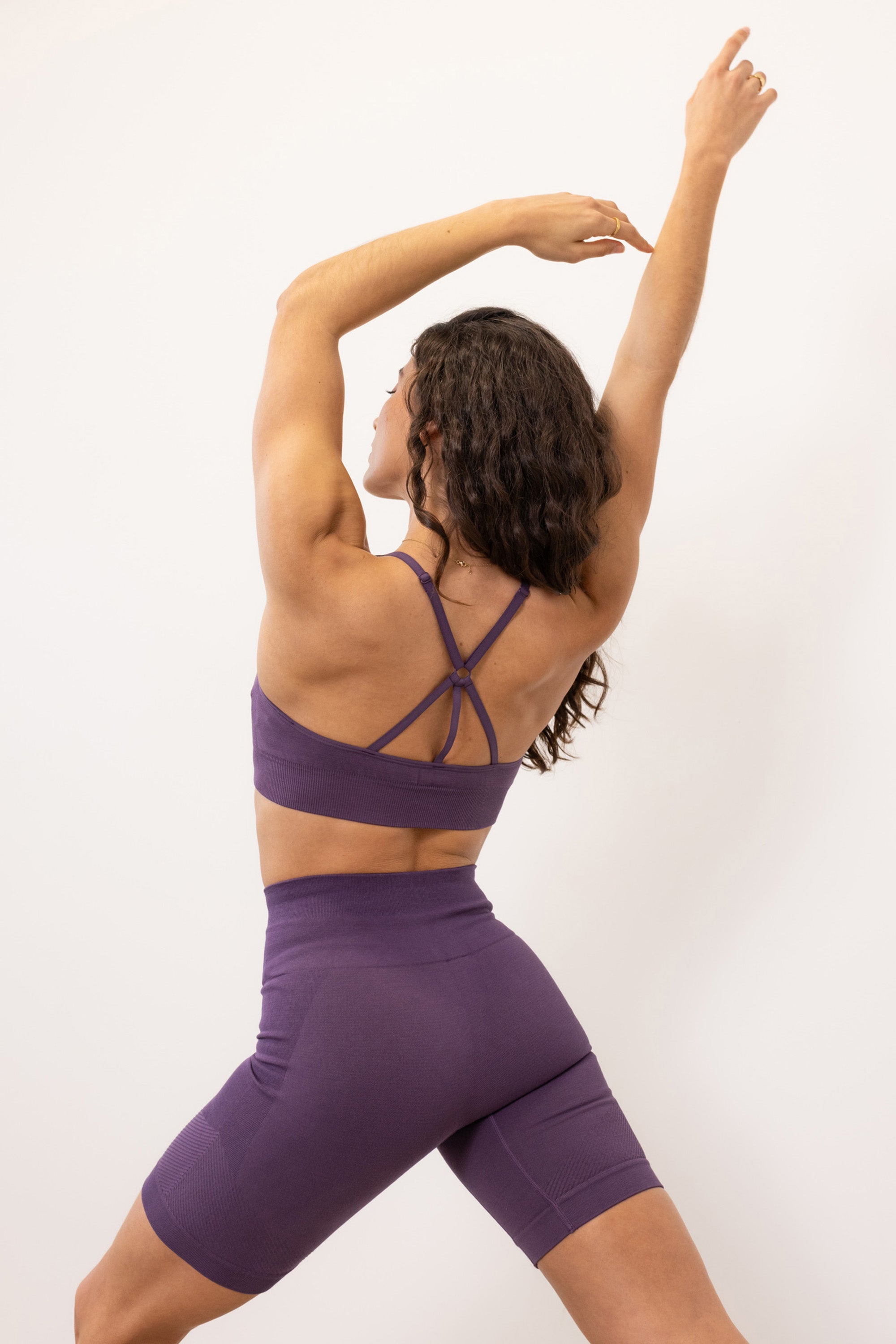 Purple ribbed recycled modal shorts and padded supportive sculpting sports bra for running, yoga, gym and pilates from sustainable activewear brand Jilla Active  Edit alt text