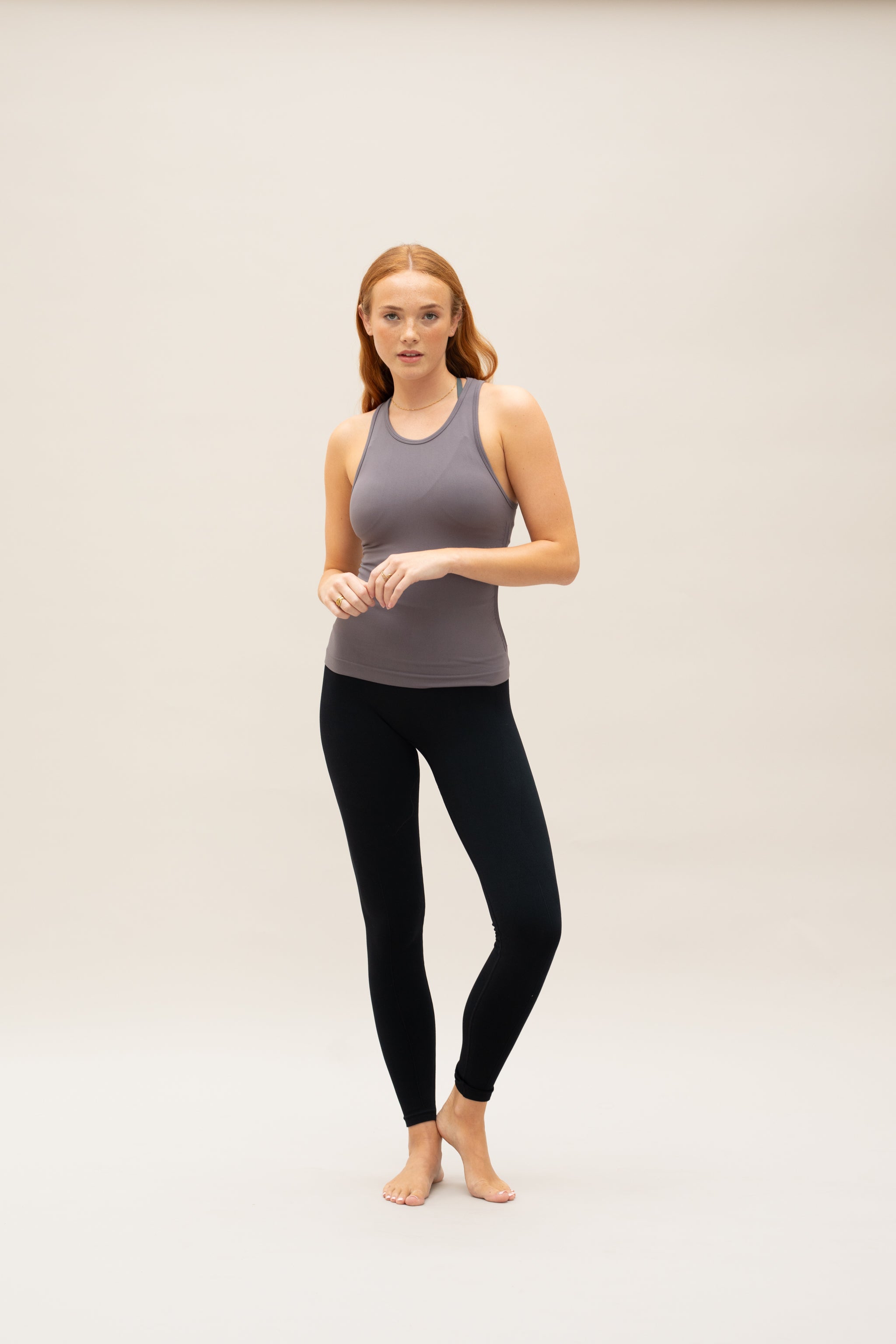 Taupe grey bown seamless recycled moisture wicking sleeveless tank top with side ruching for yoga, pilates, gym, cycling, running and exercise by sustainable activewear brand Jilla Active