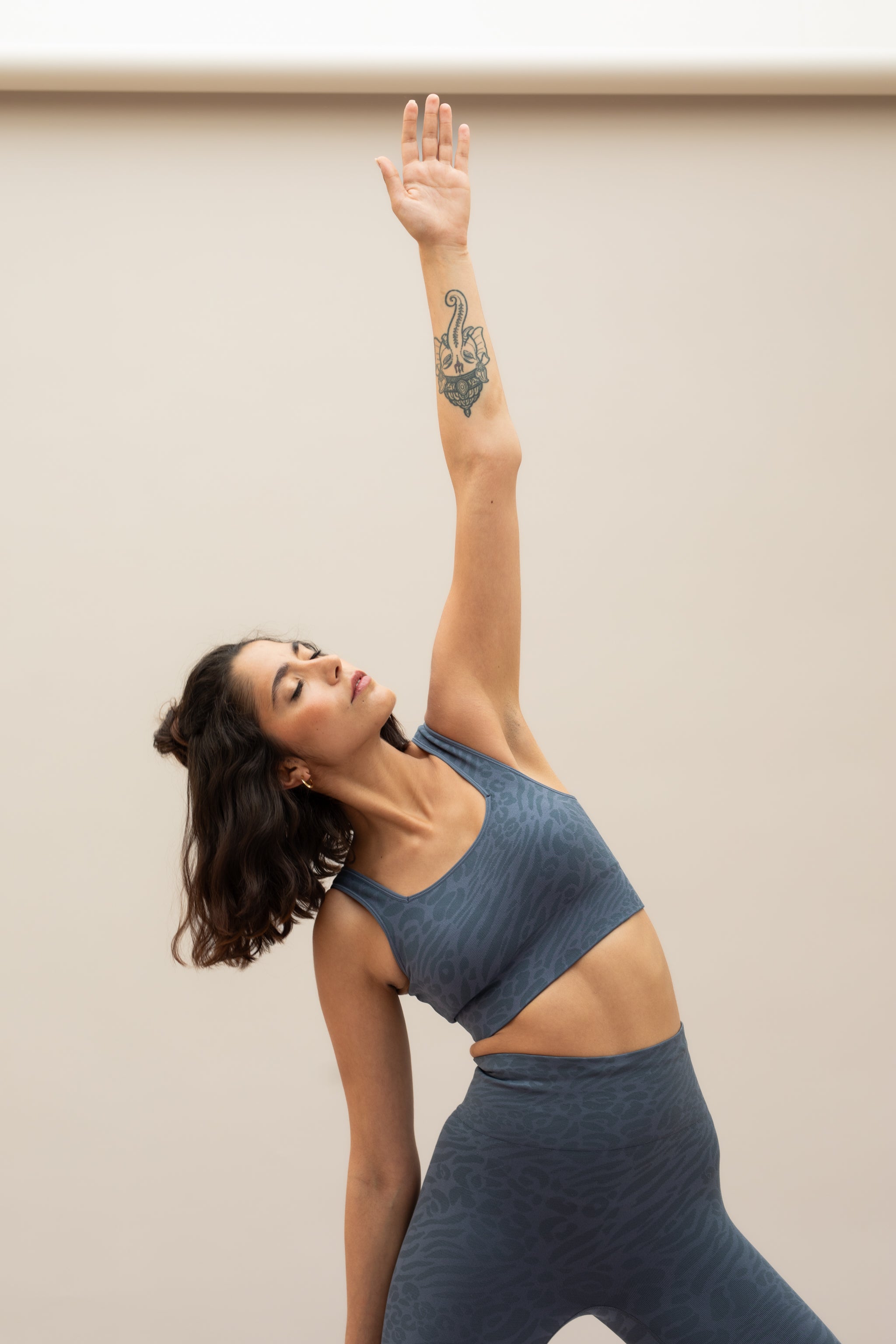 Blue leggings and blue recycled sports bra for sustainable activewear brand, Jilla.