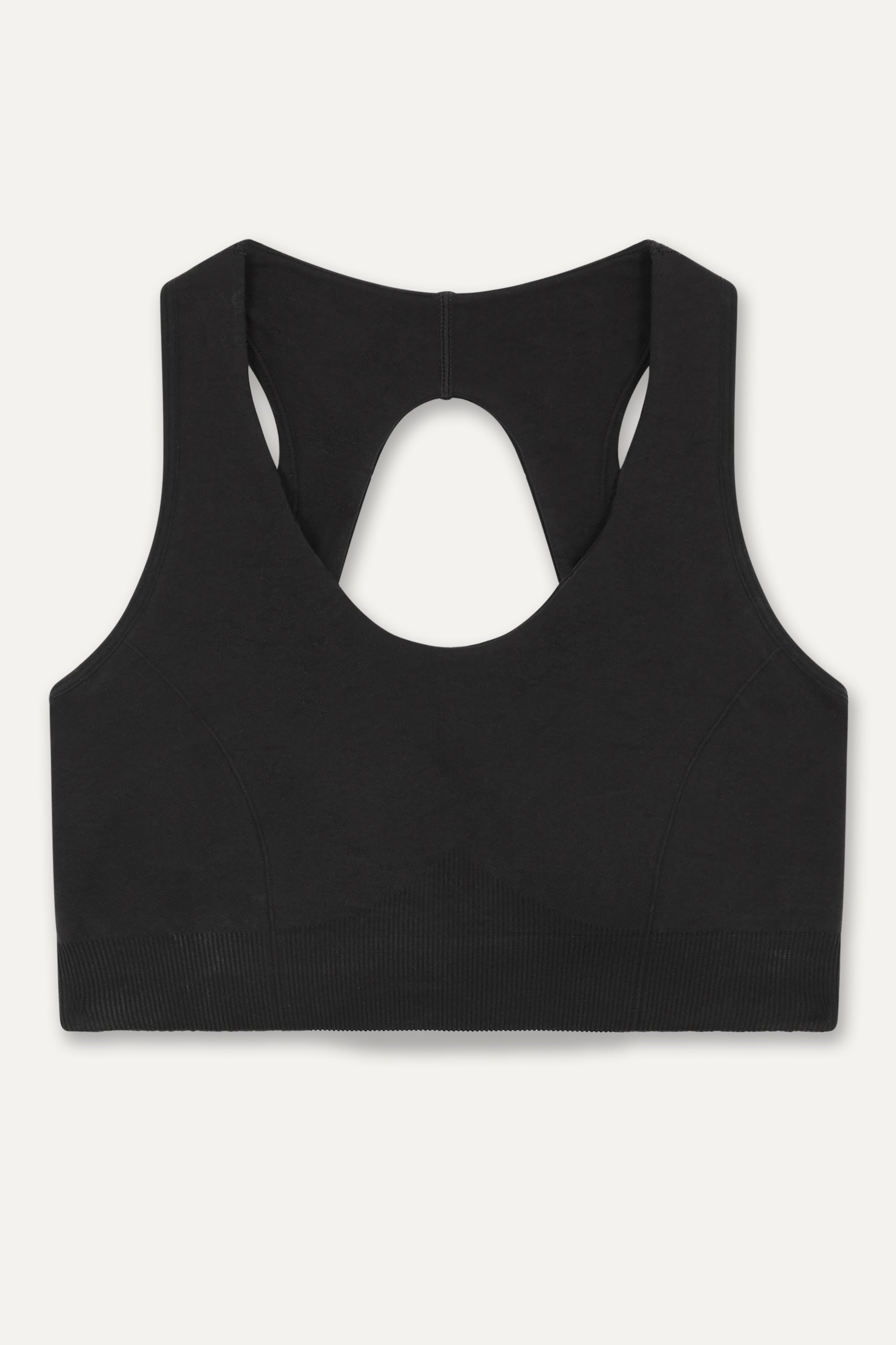 Black recycled supportive sports bra and black leggings from sustainable women's activewear brand, Jilla.  