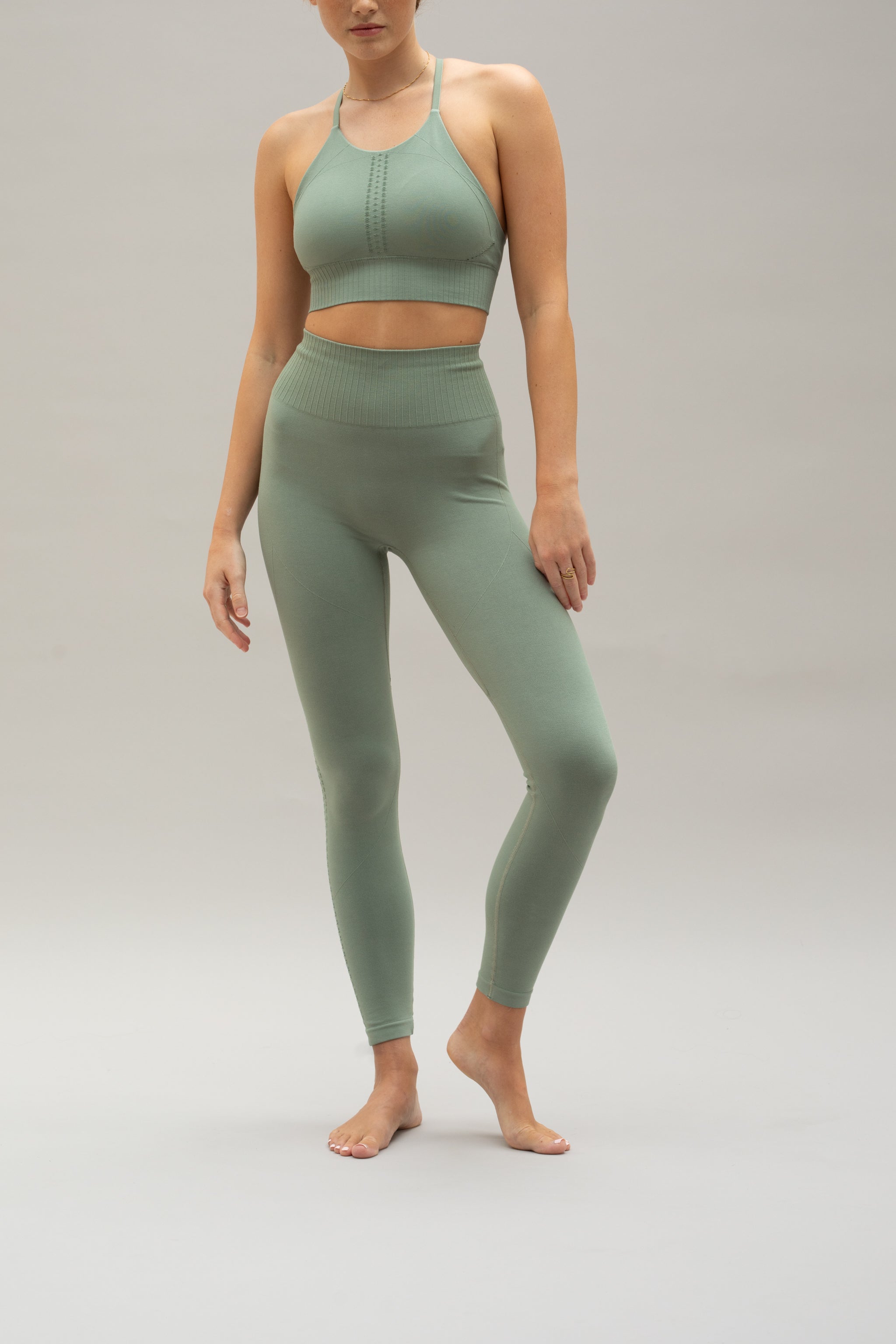 Green supportive modal cropped sports bra and green high waisted modal leggings from sustainable women's activewear brand, Jill.