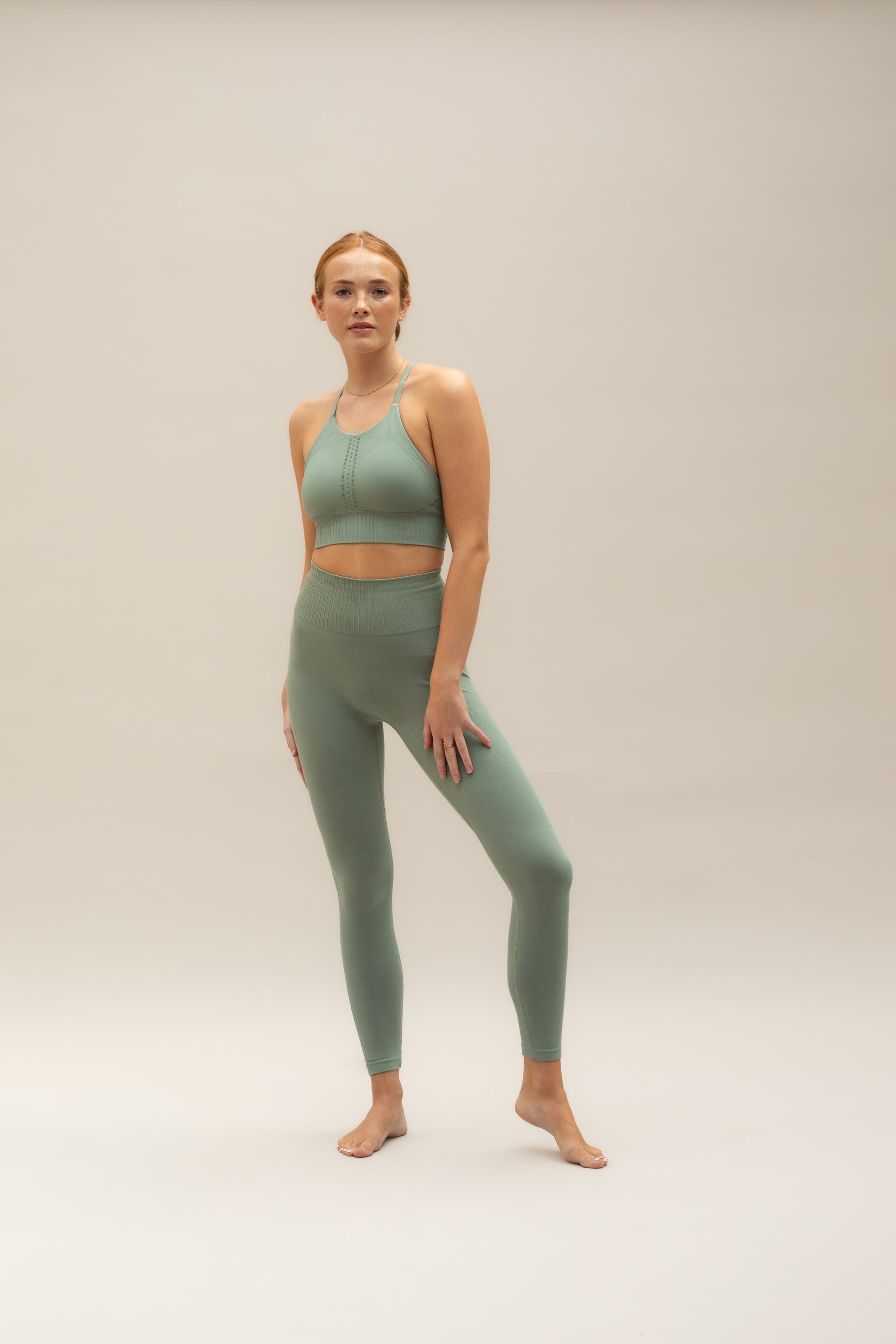 Green supportive modal cropped sports bra and green high waisted modal leggings from sustainable women's activewear brand, Jilla Active.