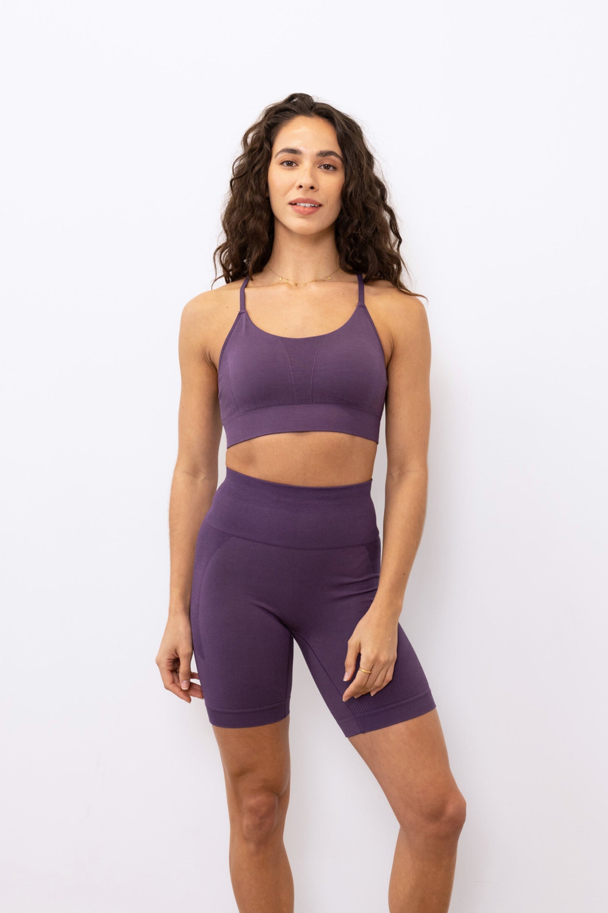 Purple ribbed recycled modal shorts and padded supportive sculpting sports bra for running, yoga, gym and pilates from sustainable activewear brand Jilla Active Edit alt text