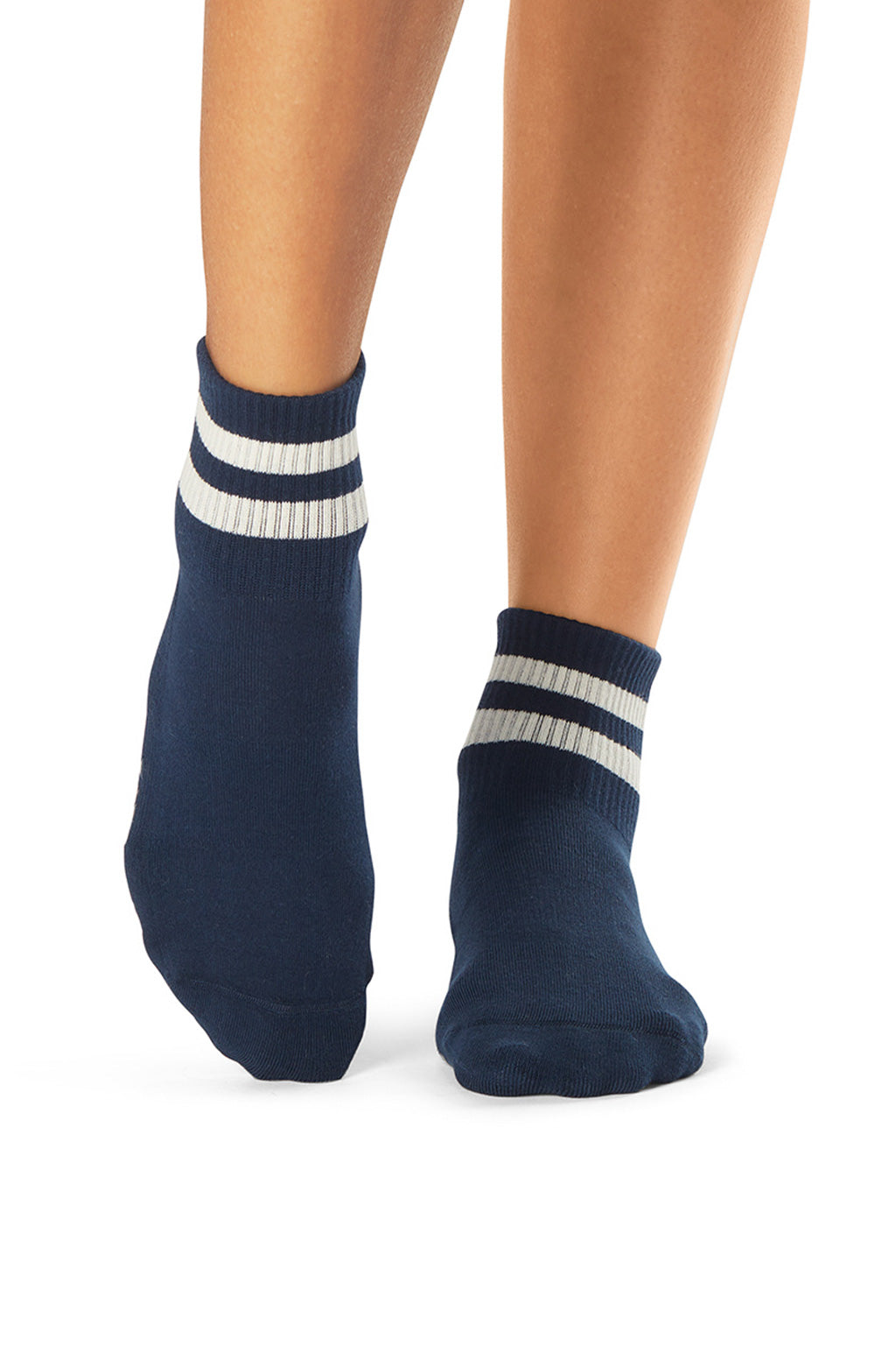 High density navy rubber grip activewear socks for yoga, pilates, gym, and exercise from Tavi featured by sustainable women's activewear brand Jilla Active   