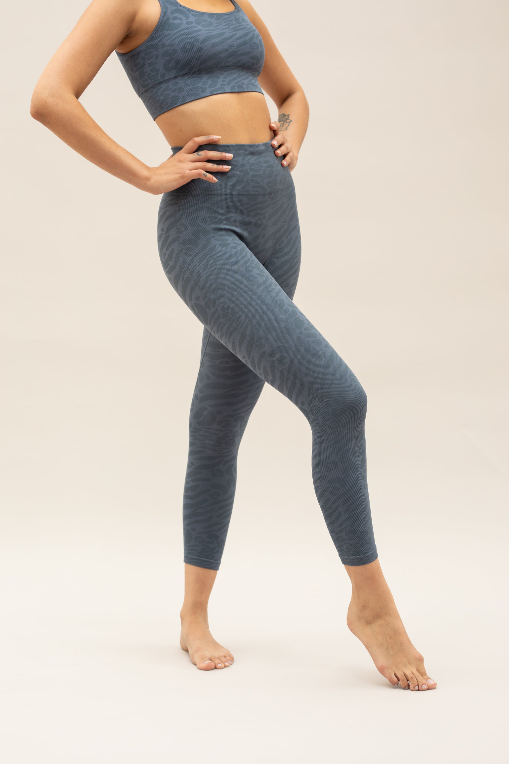 Blue leggings and blue supportive sports bra for sustainable activewear brand, Jilla.