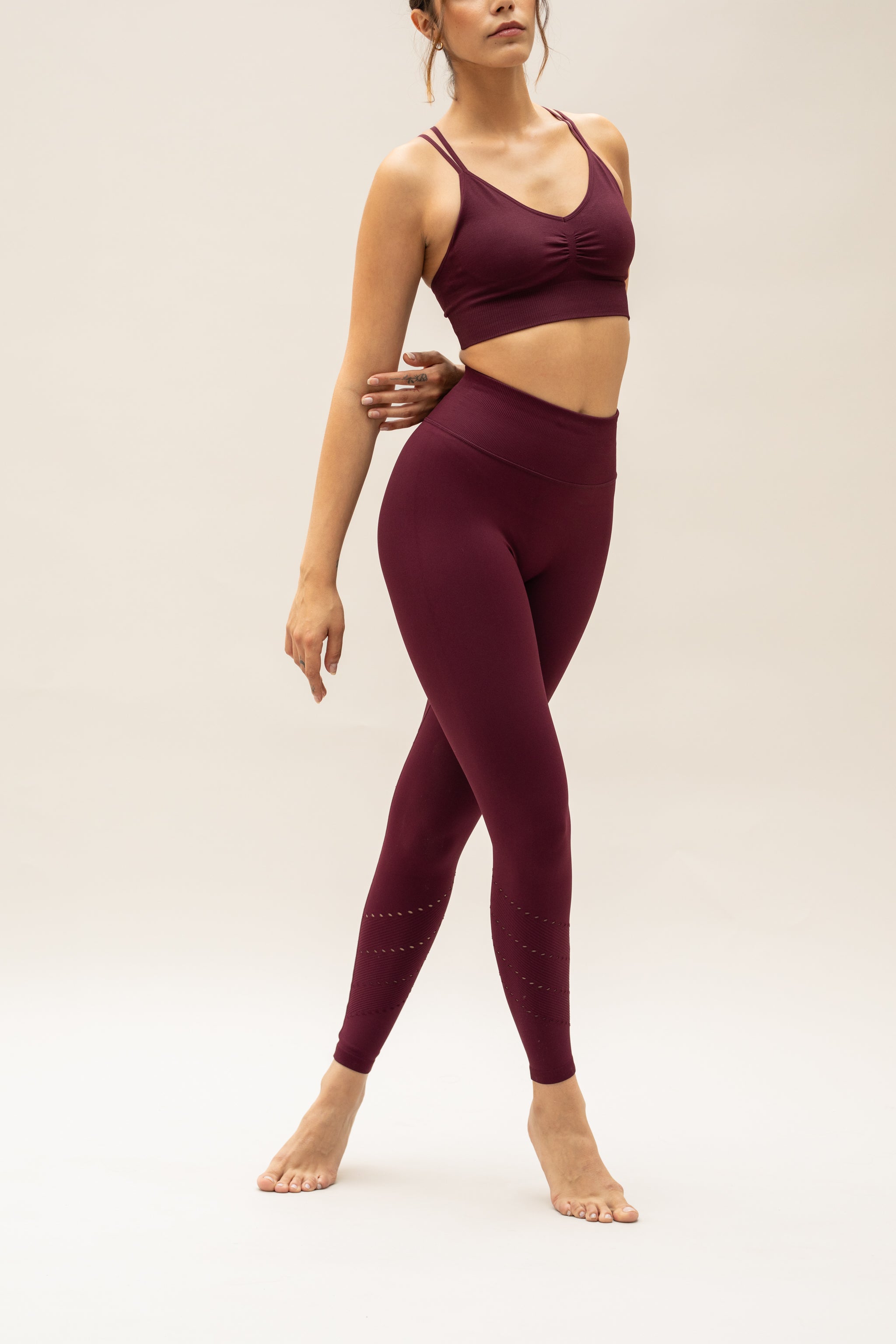 Purple red leggings and purple red bra for women by sustainable activewear brand Jilla. 