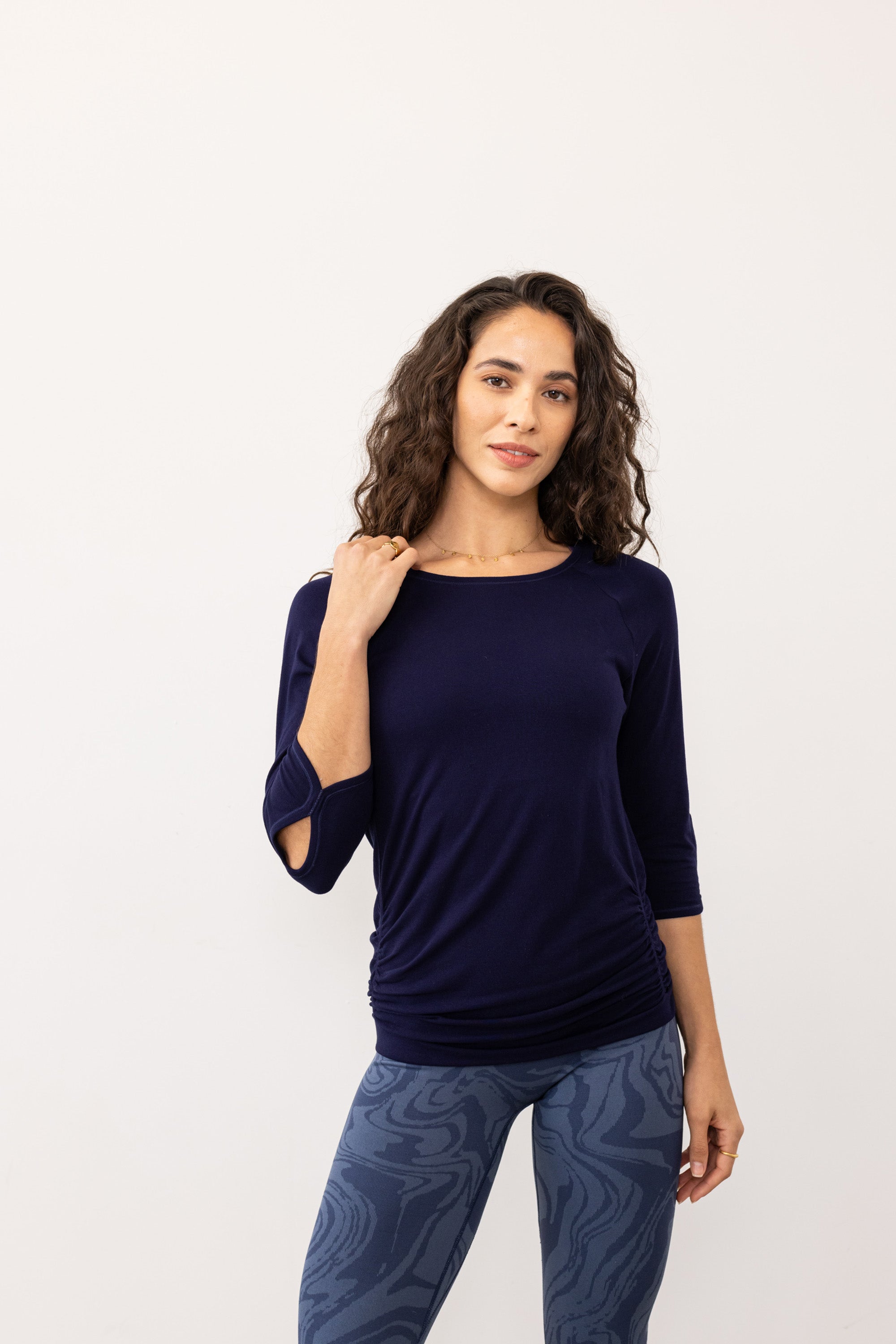 Navy blue soft bamboo 3/4 sleeve performance round neck top with side ruching for yoga, pilates, running and exercise by sustainable activewear brand Jilla Active. 