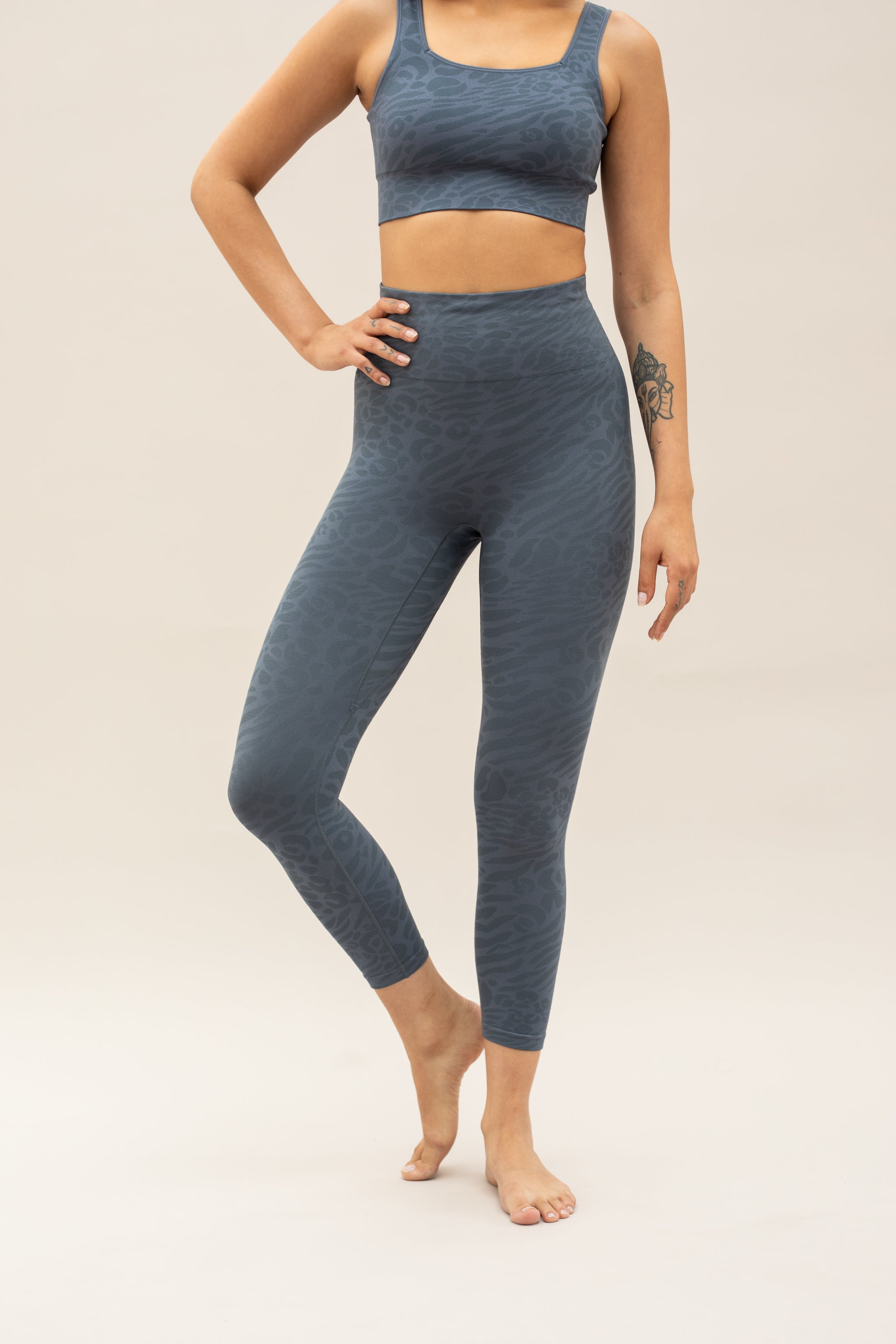 Blue leggings and blue supportive sports bra for sustainable activewear brand, Jilla.