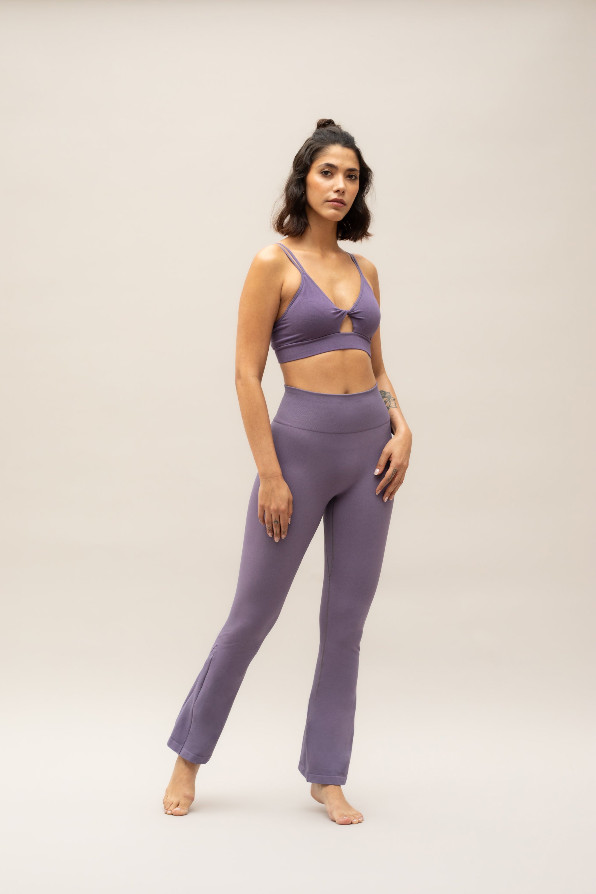 Purple flare leggings with purple supportive sports bra by sustainable women's activewear brand, Jilla.