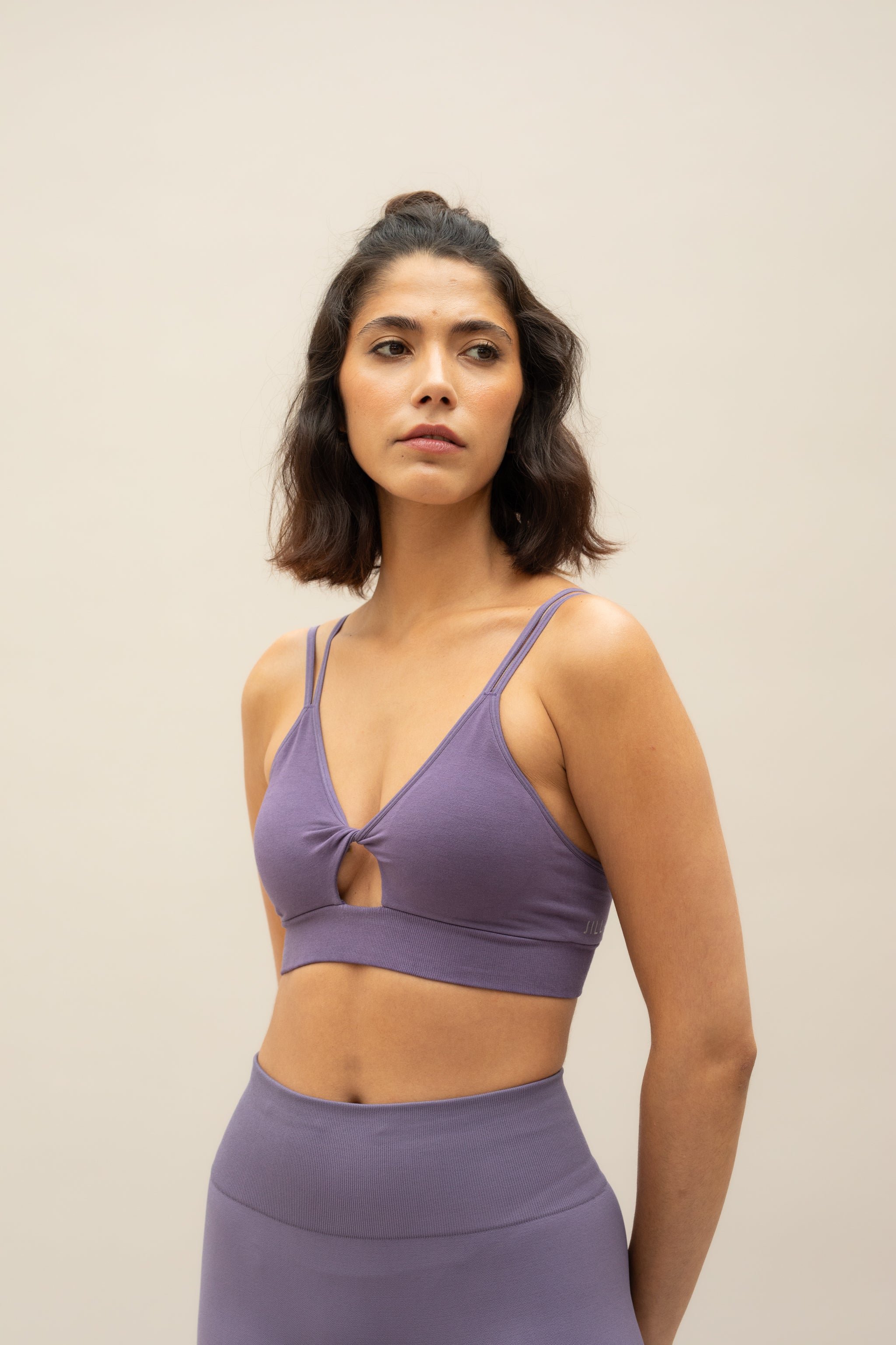 Twisted front purple supportive sports bra from sustainable activewear brand, Jilla. 