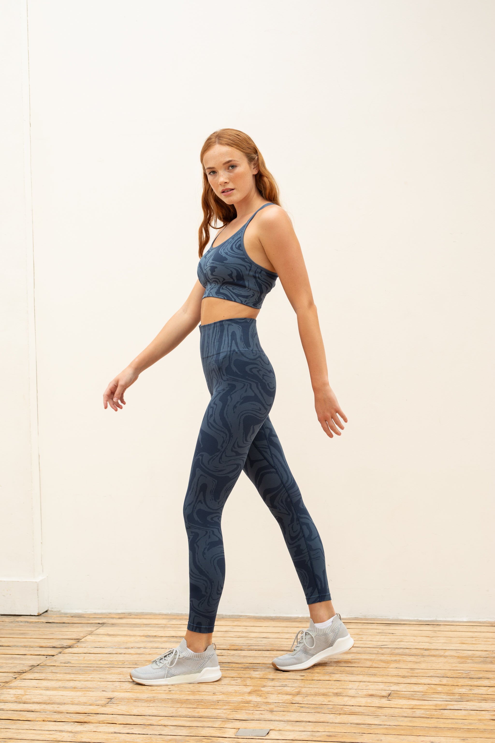 Denim blue marble effect jacquard high waist leggings and supportive sports bra by sustainable women's activewear brand, Jilla.