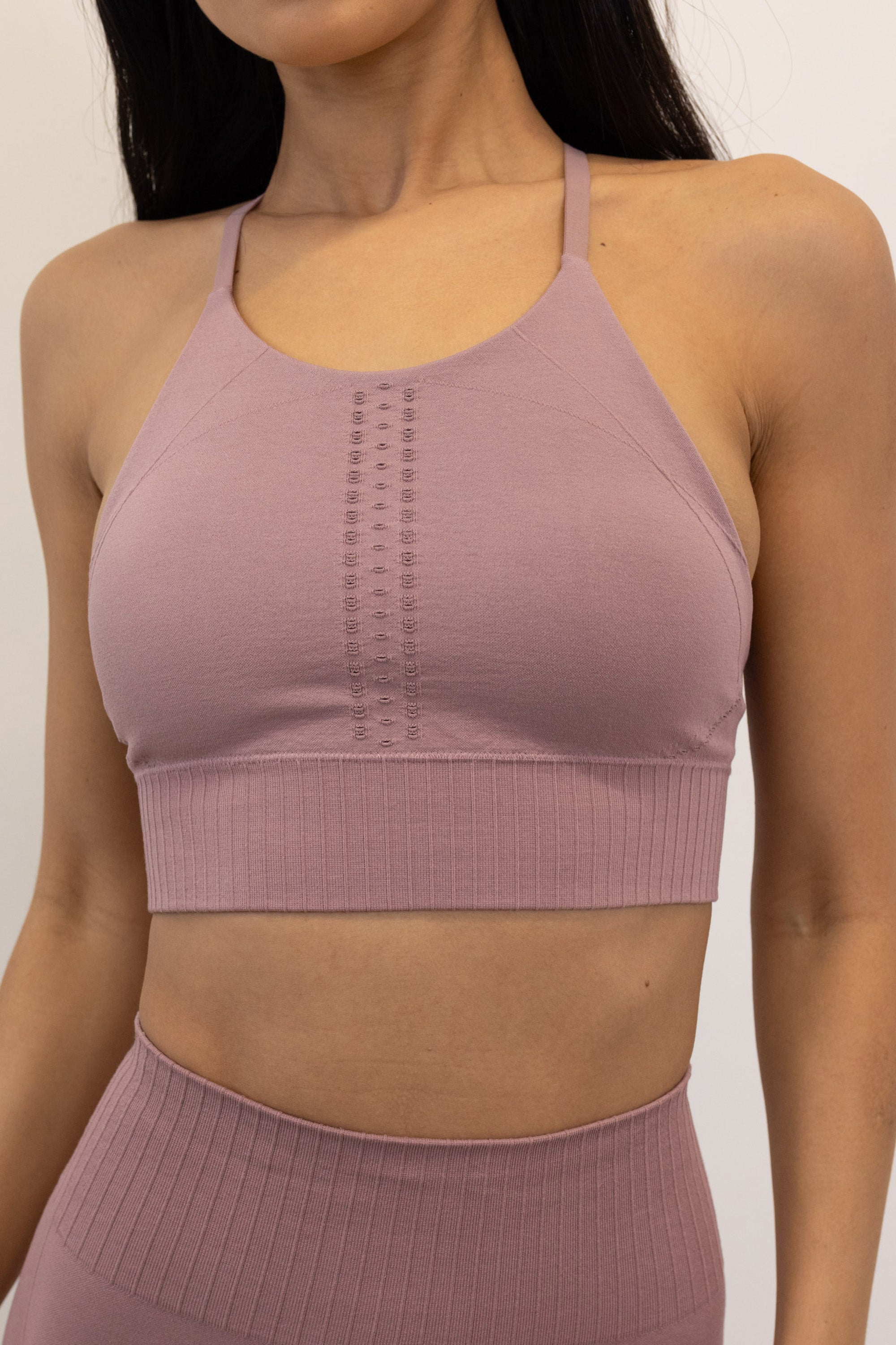 Dusky dusty pink purple long line high neck sports bra top with adjustable straps and removable padding from seamless recycled fabric for yoga, pilates, barre, gym and exercise by sustainable activewear brand Jilla Active 