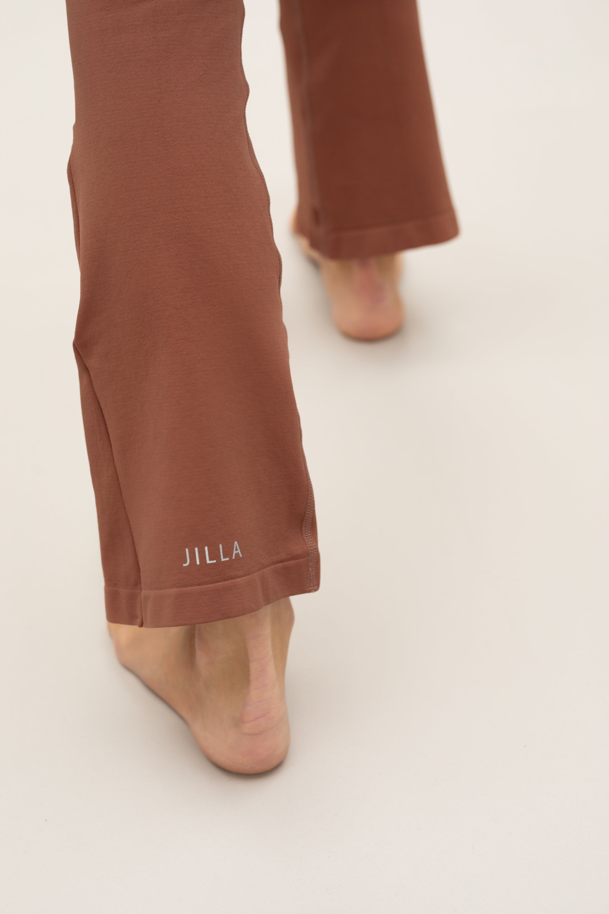 Cinnamon flare leggings with Cinnamon supportive sports bra by sustainable women's activewear brand, Jilla.  