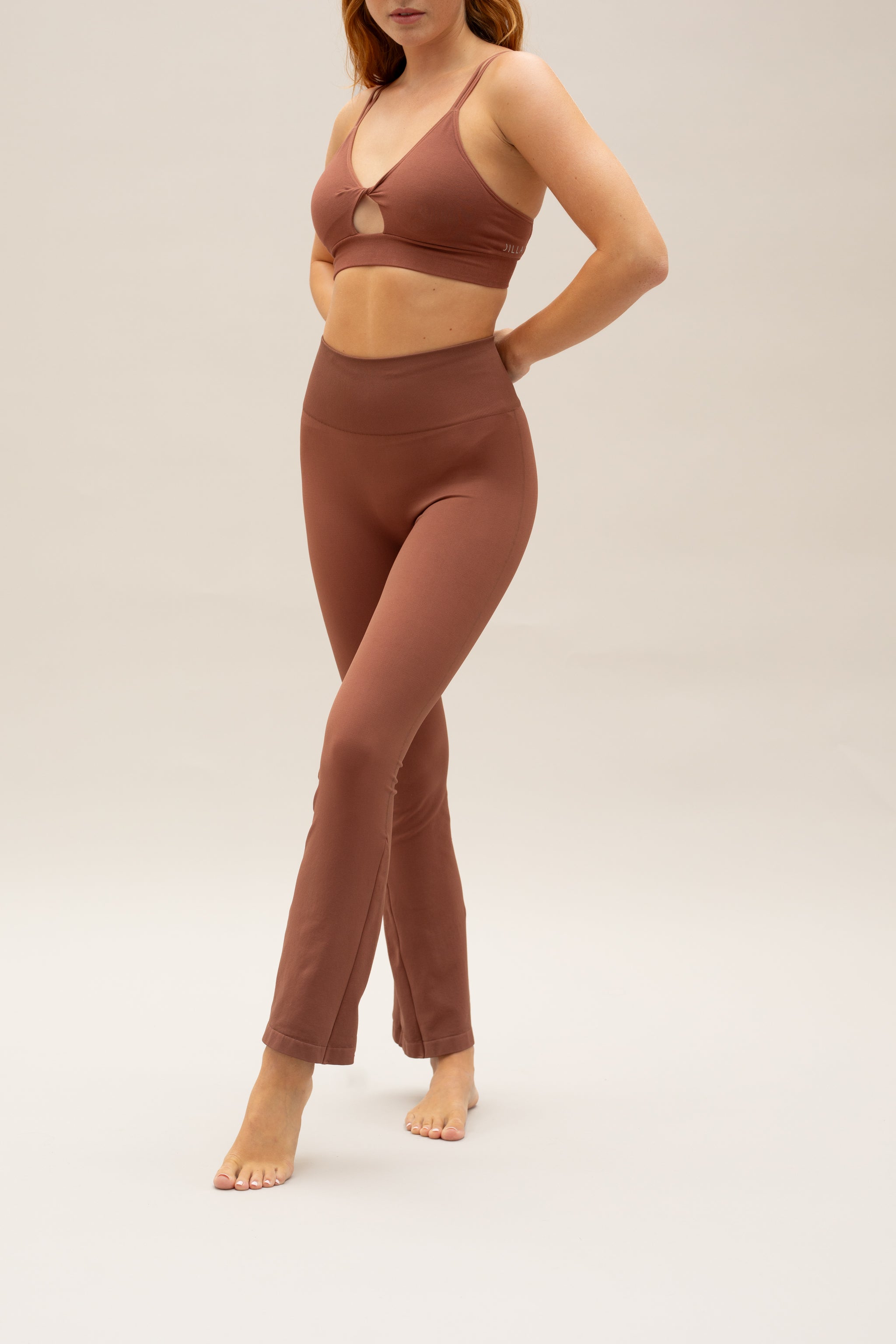 Cinnamon flare leggings with Cinnamon supportive sports bra by sustainable women's activewear brand, Jilla.