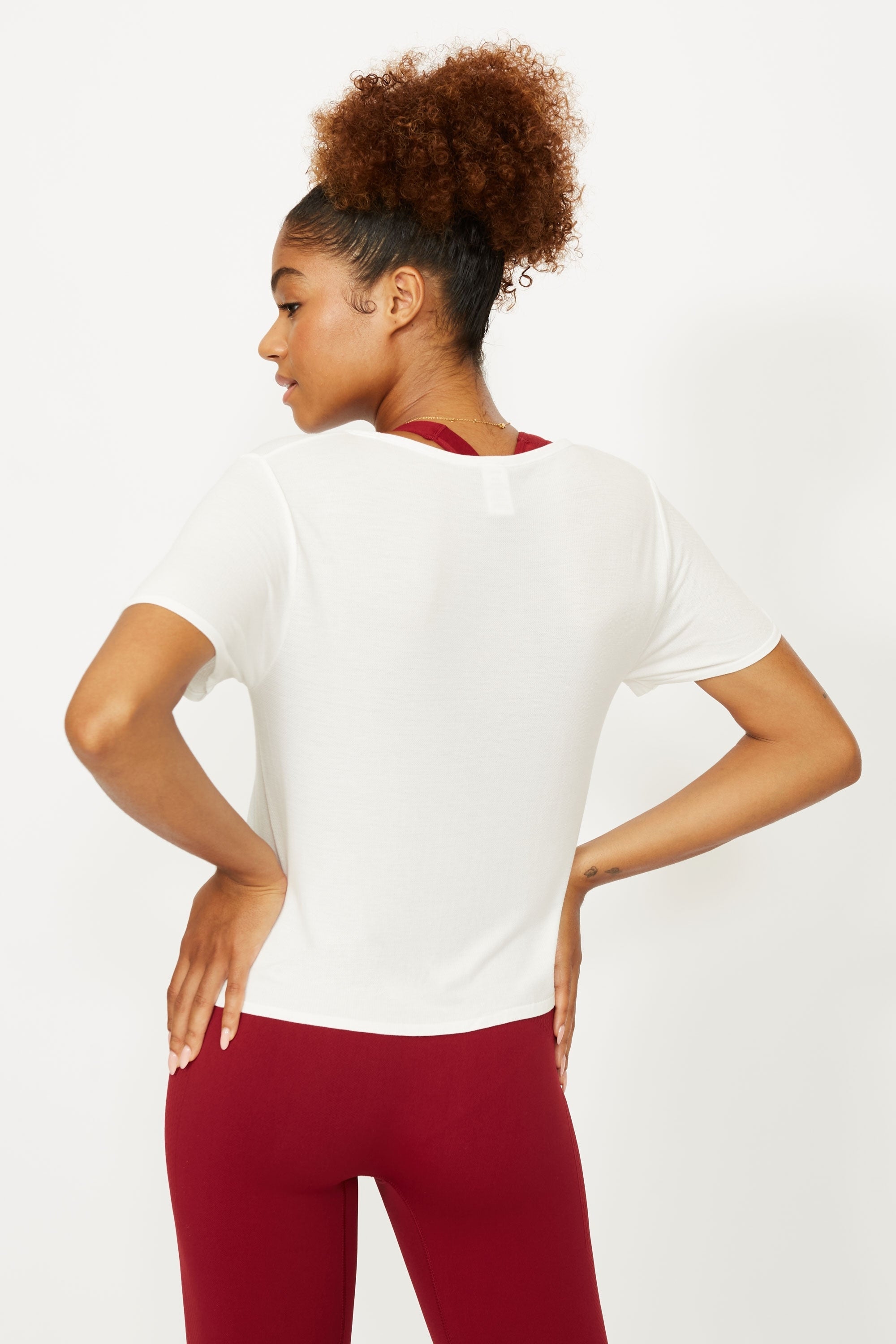 Model wearing white t-shirt for sustainable activewear brand, Jilla