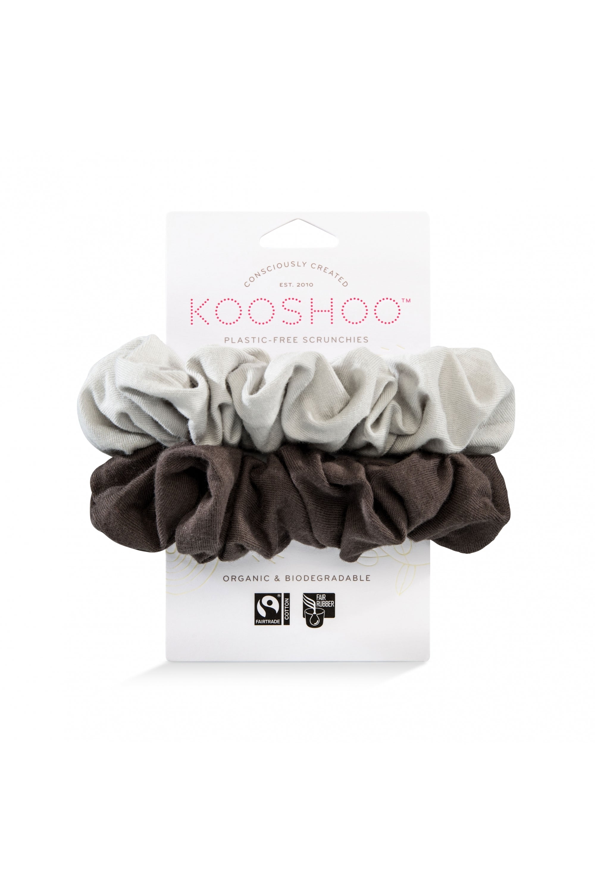 Modern eco-friendly scrunchies with an '80s nod. Made from 100% fair trade, biodegradable materials. Soft organic cotton exterior, plastic-free inner elastic for comfortable, secure hold. Stylish and sustainable accessory in white and beige, suitable from workouts to outings.
