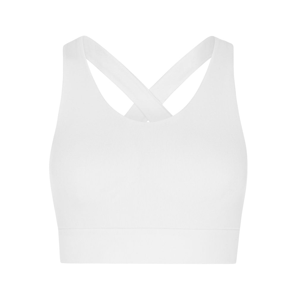 Model wearing white supportive sports bra for sustainable activewear brand, Jilla.